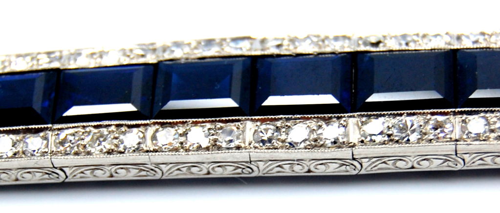 Beautiful sapphire and diamond bracelet with hand engravings on the sides.