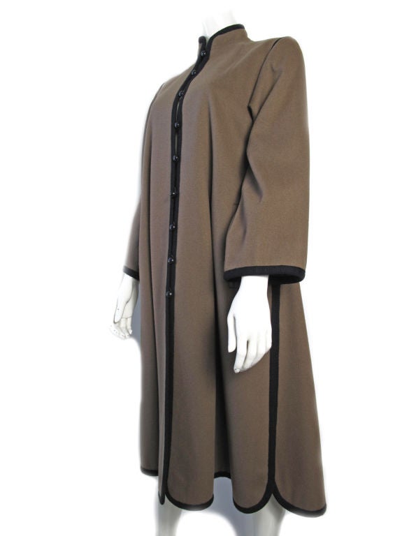 Yves Saint Laurent Rive Gauche wool coat , fall/winter 1976 - 1977 Russian Collection. Taupe with black trim, two side pockets, bell sleeves and mandarian collar. <br />
<br />
38