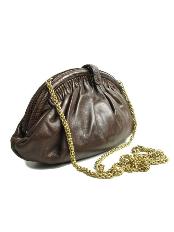 Chanel brown leather purse with lizard trim and gold metal chain strap. 10 1/2