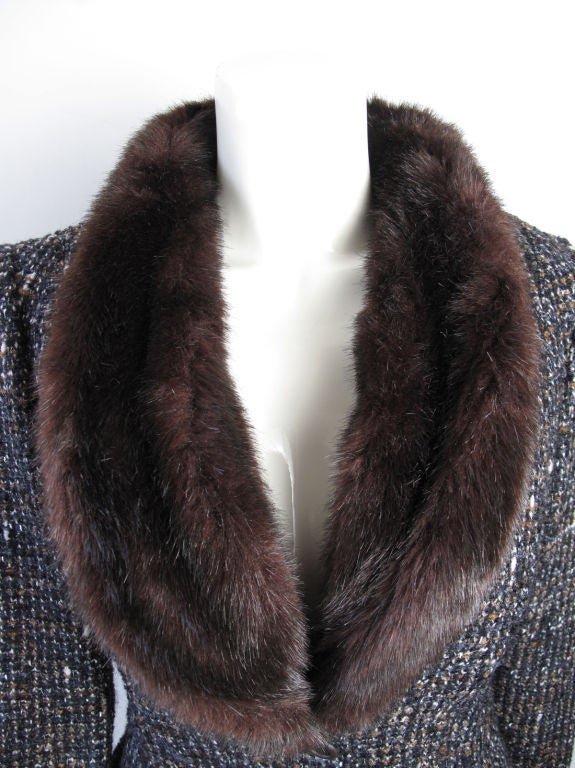 Thierry Mugler wool suit with fake fur collar and cuffs. <br />
<br />
Blazer:34
