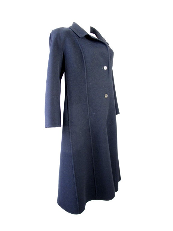 Gucci 1980s black wool coat with GG buttons. Side pockets. Condition: very good
40