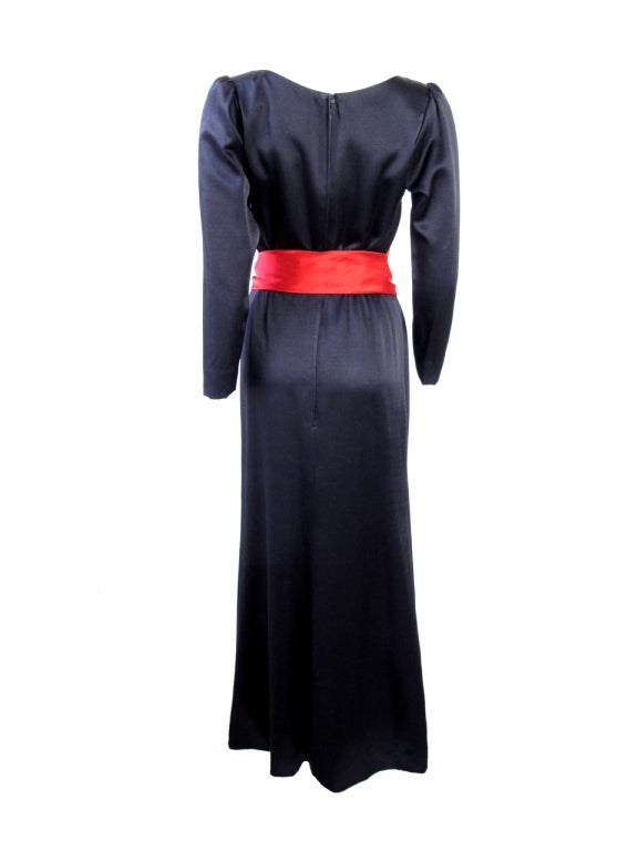 YVES SAINT LAURENT gorgeous sik red and black evening gown with belt. Condition: very good

34