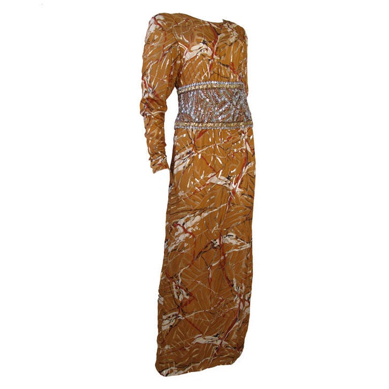 Galanos brown chiffon long sleeve dress with heavily beaded waist. <br />
<br />
35