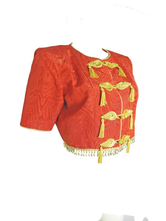 YVES SAINT LAURENT

Yves Saint Laurent Rive Gauche cropped red silk jacket with gold metallic tassels and beads at hem. 37