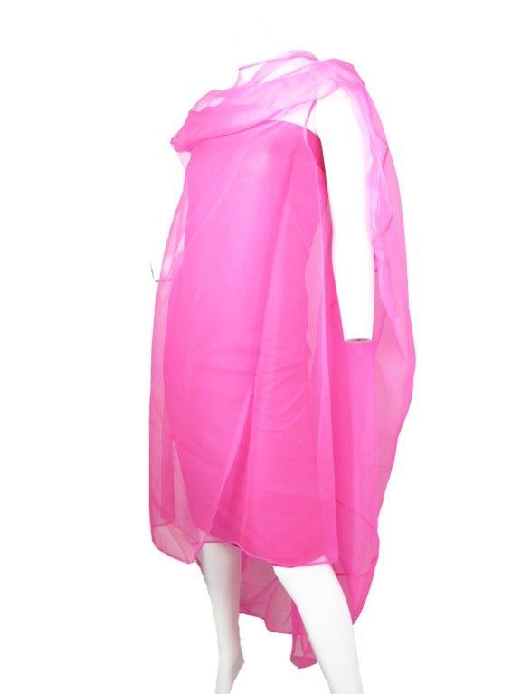 Jil Sander hot pink evening dress.  Strapless bandage dress underneath made of nylon and spandex (size 40)  and silk caftan overlay ( size 36).  Condition: good, small tear at seam, original tags still attached.
We accept returns for refund, please