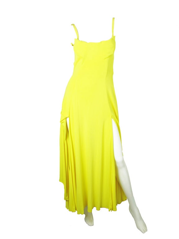 1990s Versace Couture bright yellow gown with 5 slits.  Built in bustier.  With bike shorts.  34