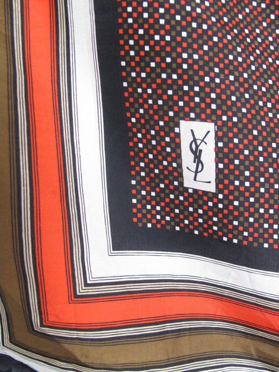 Vintage Yves Saint Laurent silk scarf. Orange, brown, white and black.   Condition:Excellent.  26