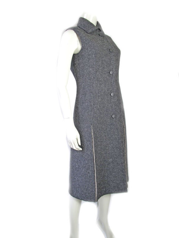 Givenchy charcoal grey wool skirt suit. Long sleeveless jacket and skirt. Condition:Excellent. <br />
Jacket: 38
