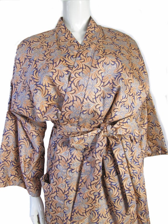 Geoffrey Beene printed robe coat/ dress. No fabric label, possible cotton with silk lining. Two front pockets and waist belt. Condition:Excellent. 52