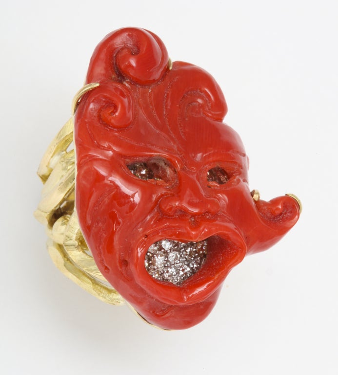 One of a kind, expertly carved coral and diamond mask ring.  Absolutely unique and completely handmade by the best Italian artisans.

From a family of jewelers dating back to 1927, Michael Kanners is renown as both a creator and a purveyor of rare