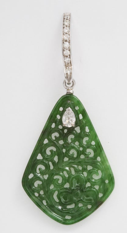 Carved jade drops accented with pear shape diamonds hang delicately, and elegantly, from the ear.  From a family of jewelers dating back to 1927, Michael Kanners is renown as both a creator and a purveyor of rare and unique gems.