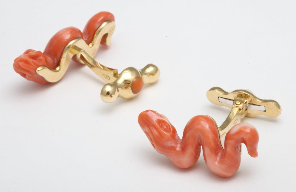 Coral snakes, finely carved in Southern Italy and mounted in 18kt yellow gold and enamel.  Cufflinks designed by Michael Kanners are known the world over for their superior craftsmanship and intricate details.  Rare and always unique, they are