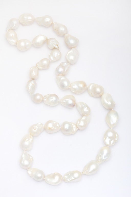 This fantastic necklace features 36 pearls ranging in length from 13-24mm and is completed by an invisible mystery clasp.  It can be worn long or as a double choker.  It is impressive in it's size, length and the beautifully, natural baroque