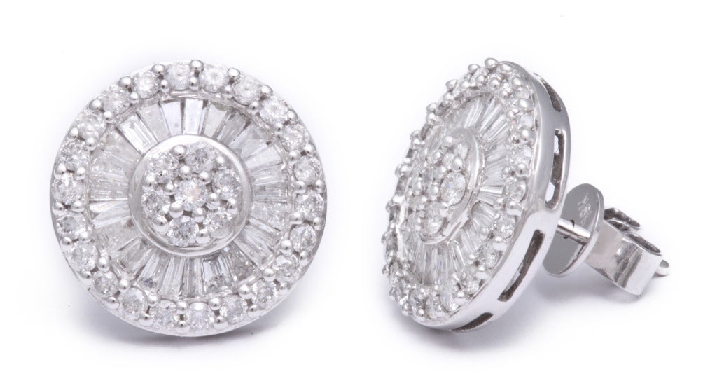 Setting themselves apart from the rest of the pack, these earrings feature beautiful baguette cut diamonds.  Easy to wear, and comfortable, they are a staple of any jewelry wardrobe.  Total diamond weight is 2cts.  This is the large size