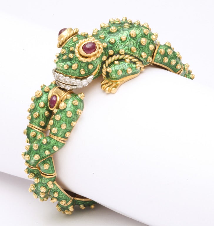 A wonderful example of David Webb's incredible creativity and craftsmanship, it does not get any more iconic than this.  Articulated green enamel links are highlighted with 18kt gold warts and this wonderful frog features ruby eyes and diamond lips.