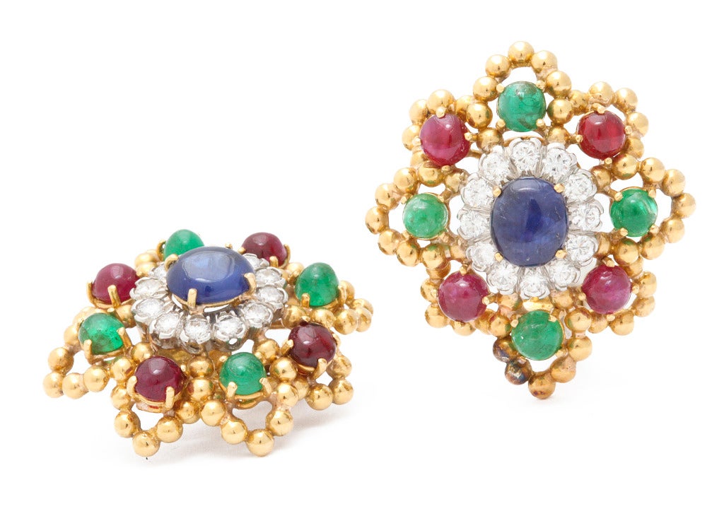 Bold and colorful David Webb earclips featuring ruby, emerald and sapphire cabochons accented with white diamonds.

From a family of jewelers dating back to 1927, Michael Kanners is renown as both a creator and a purveyor of rare and unique gems.