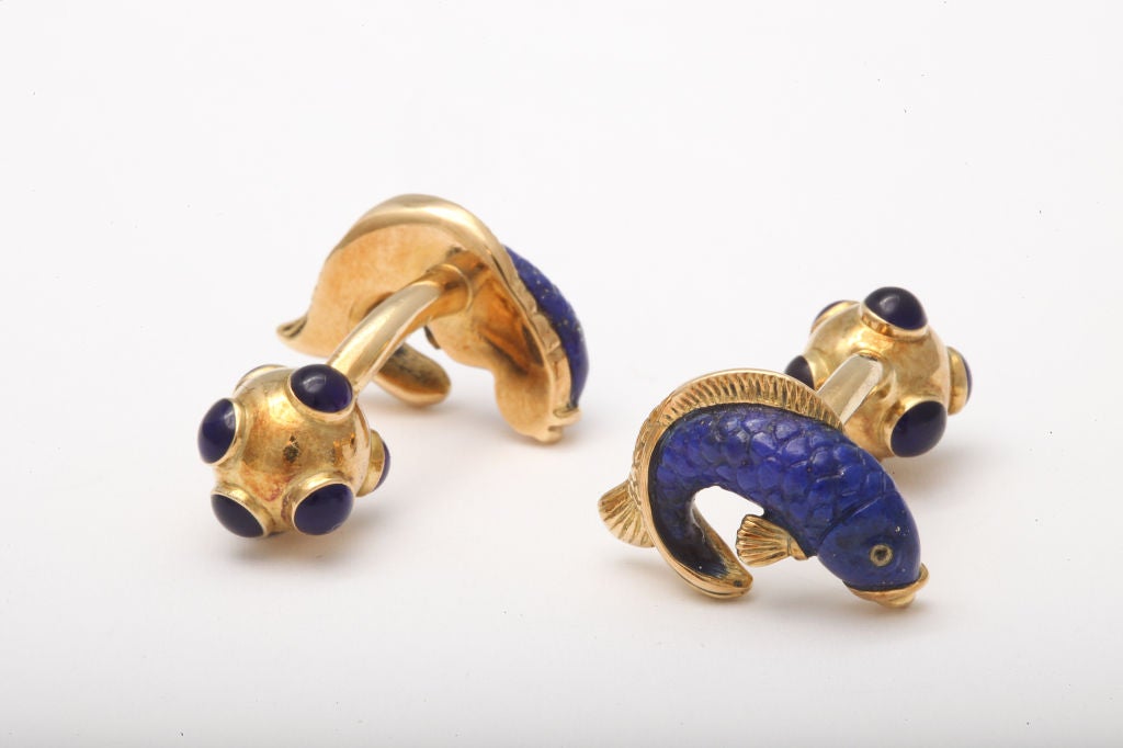 These highly detailed fish are carved from the finest lapis lazuli and then carefully inserted into the 18kt gold handmade mounting.  Such precision exemplifies an elite collaboration between a master stone carver in Germany and an equally talented