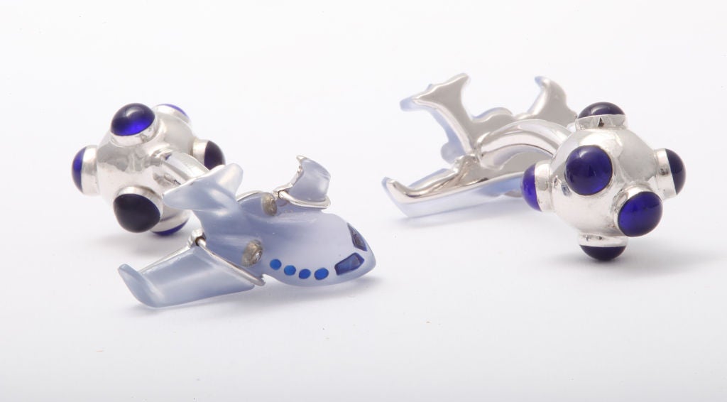 These exquisite cufflinks are for the true connoisseur of private aviation.  As the finest jets display their superiority in elite workmanship and their attention to detail, so do these wonderful cufflinks.  The blue chalcedony body and wings are