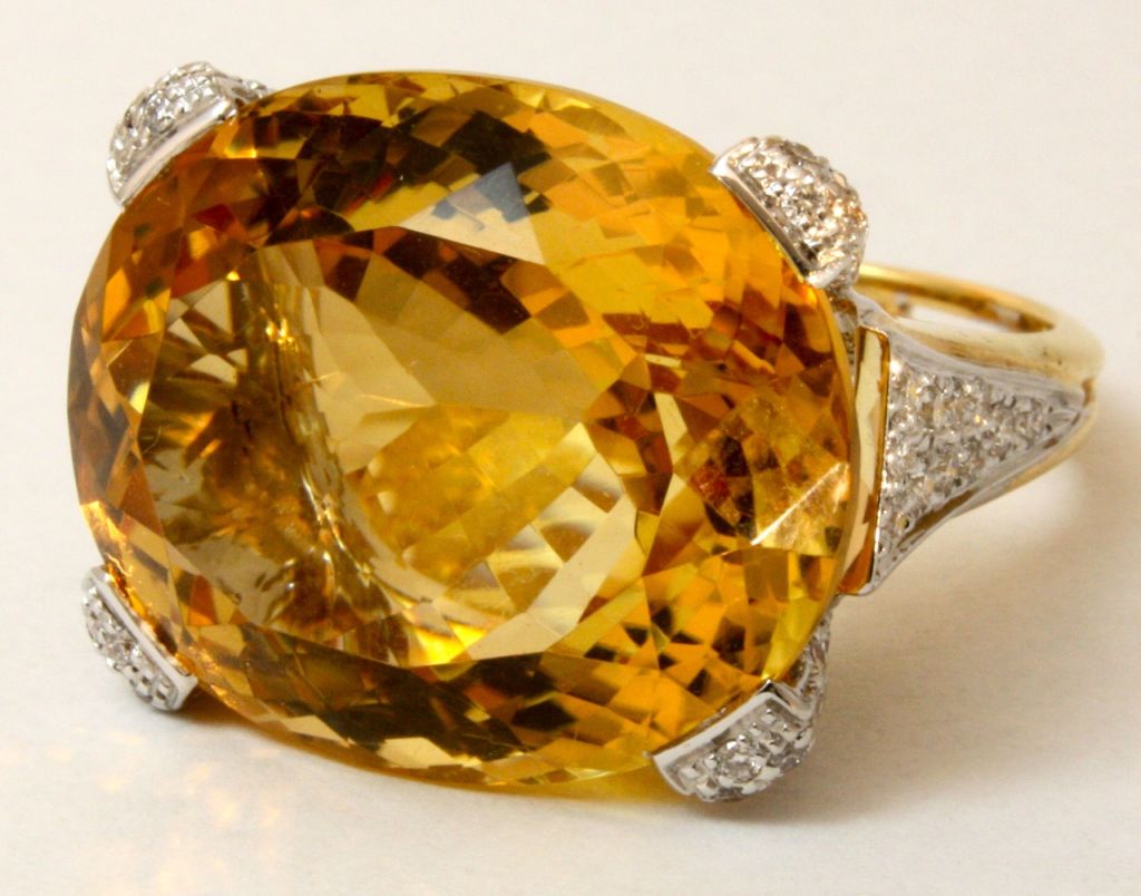 This bright and stylish ring features a rich, cognac colored citrine weighing nearly 25cts with app. 1ct of white diamonds.  Finely made in 18kt white and yellow gold, this ring is sure to make an impression while also being easily wearable.

From a