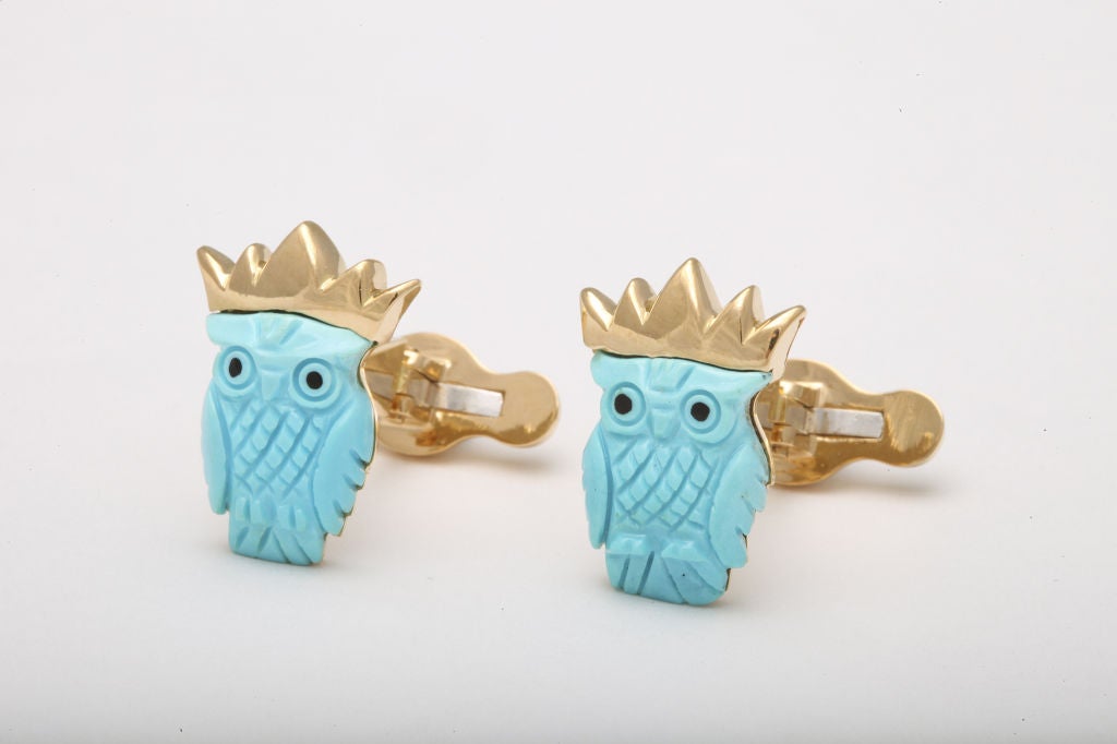 Both wise, and in this case royal, these crowned owls are at once elegant and amusing.  The carved turquoise owls are expertly crowned and mounted in 18kt gold.  The reverse features an elegant touch of royal blue enamel for good measure.<br />
<br