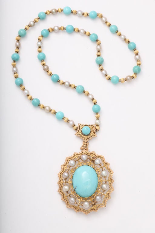 This fantastic Buccellati necklace features vibrant blue turquoise and the quintessential gold work of this famous Italian jeweler.  The pendant is detachable to be worn as a brooch adding increased wearability.  As beautiful today as it was when