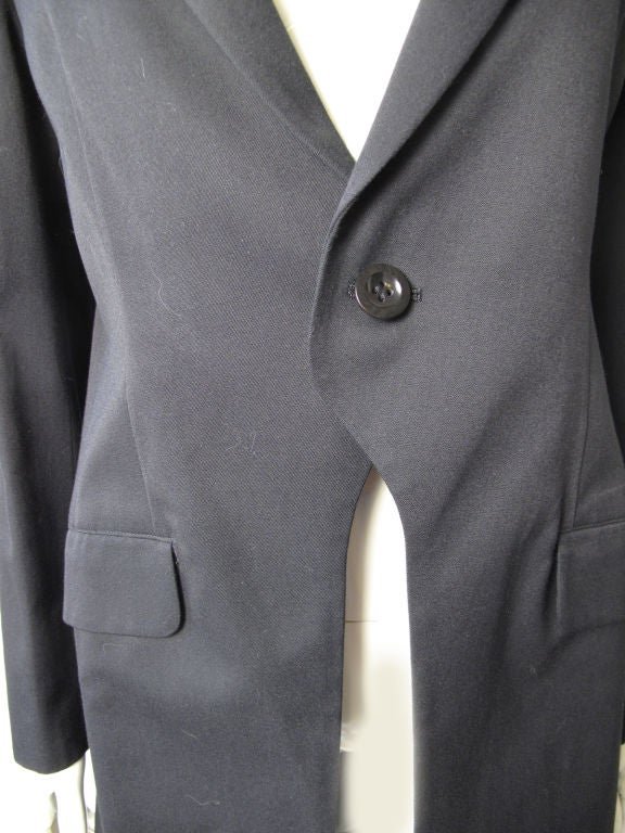 Yohji Yamamoto black wool one button long jacket. <br />
<br />
Condition:Excellent, never worn. <br />
<br />
Y's label<br />
<br />
36