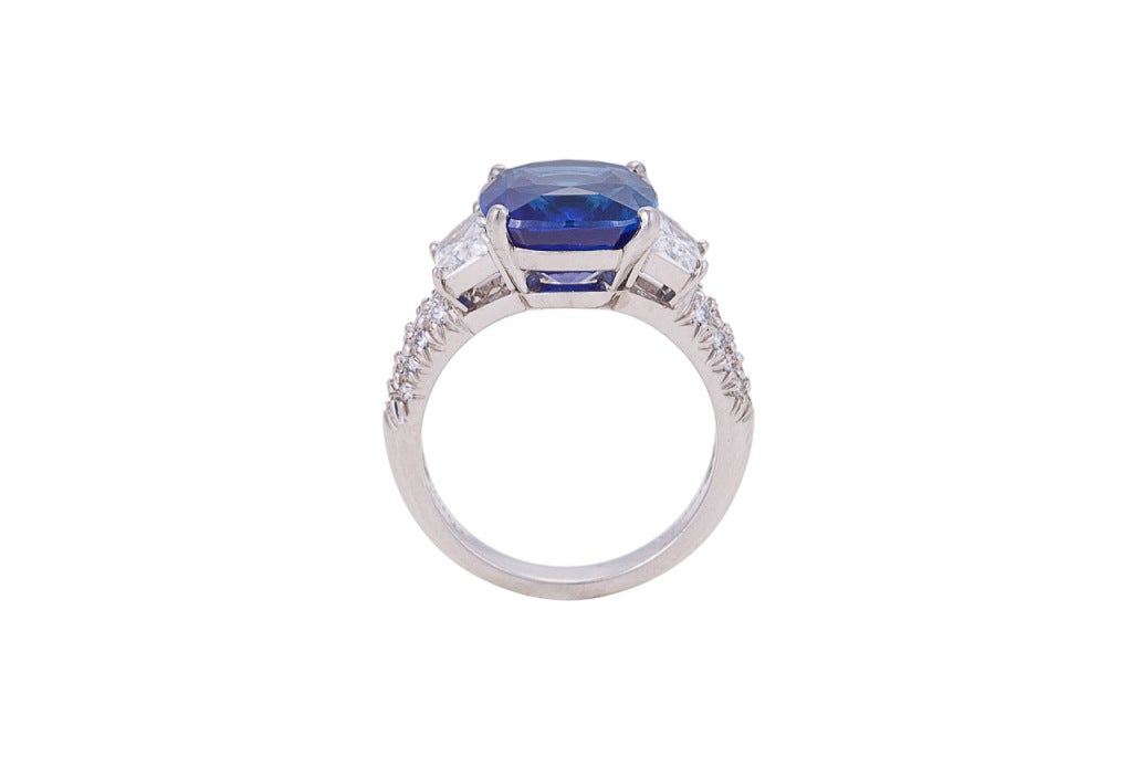 Truly amazing sapphire ring. Center stone is a NON HEAT-TREATED, cushion modified mixed-cut Ceylon sapphire, 8.02 carats with vivid saturation and eye-clean clarity, with top of the line certificate from the American Gemological Laboratory (AGL).