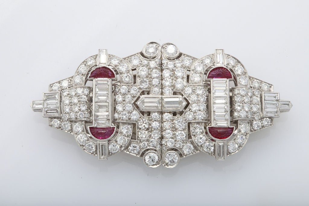 An exquisite pair of diamond and ruby double clips in platinum, on their original frame.