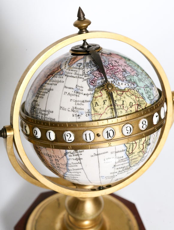 An enamel on porcelain, desk clock designed as a globe on a jasper base. An extremely rare piece Signed Redier, Paris and dated 1873.