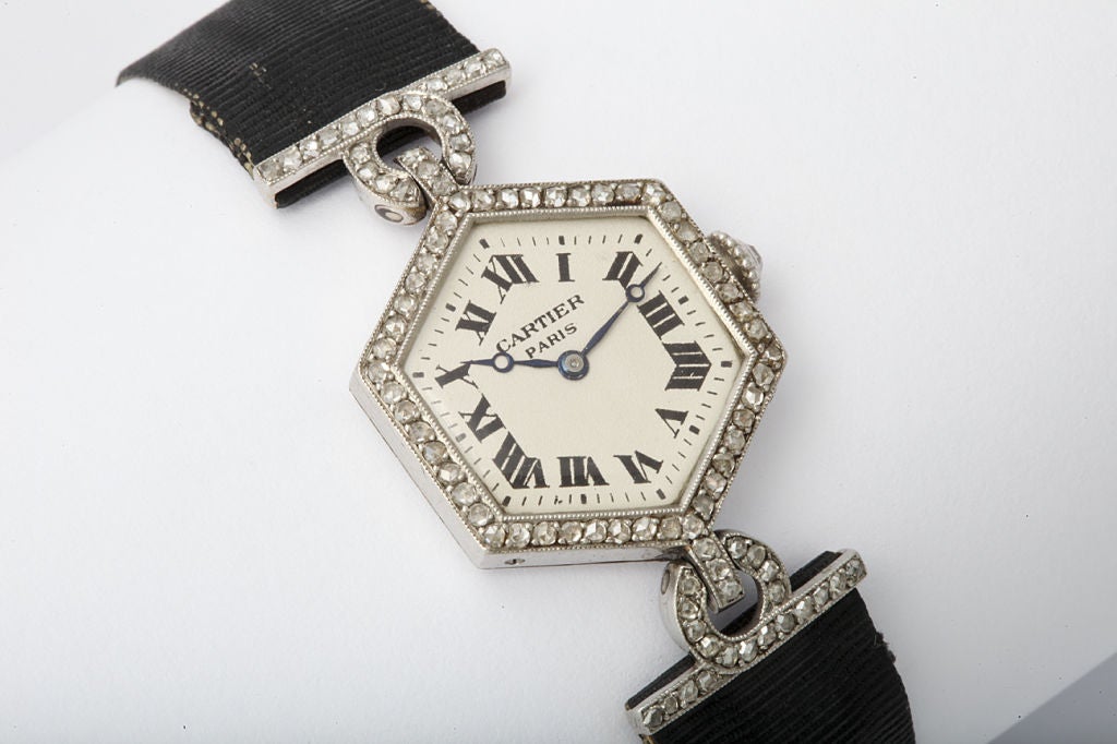 Very fine, rare, and elegant, hexagonal shaped, Art Deco, platinum, and diamond wristwatch with a diamond-set platinum and gold clasp.