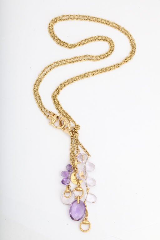 An 18 karat gold pendant and chain with briolette amethysts.