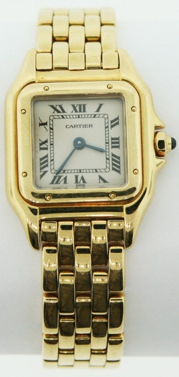 Made in the 1990's. Very fine, square, water-resistant, 18K yellow gold lady’s quartz wristwatch with an 18K yellow gold Cartier link bracelet with concealed double deployant clasp.