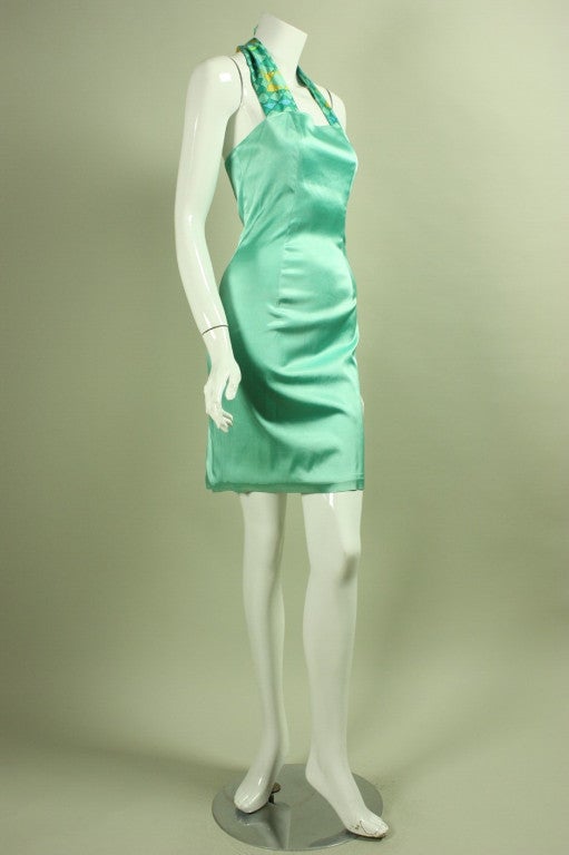 Vintage dress from Stephen Sprouse dates to 1988 and is made of mint green fabric.  Halter neckline.  Fitted throughout.  Center back vent.  Lined.  Center back zipper.

Labeled vintage size 8.

Measurements-

Bust: 32-34