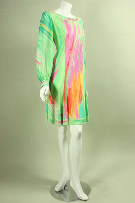 Vintage dress from Leonard dates to the 1980's.  It is made of light green silk jersey with a multicolored painterly print.  Long chiffon sleeves with double button cuff.  Center back zipper.  Unlined.

No size label.

Measurements-
Bust: