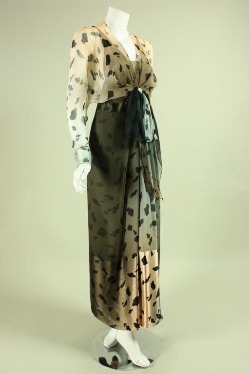 Vintage gown from Bill Blass dates to the 1980's and retailed at I. Magnin.  It is made of neutral-colored ombré silk with an animal print.  Loose-fitting, exterior bodice has v-neck and batwing sleeves with zippered cuffs.  Center front bow at