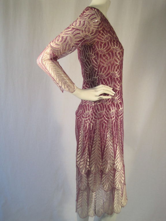 Elegant Galanos dress for Amelia Gray. Made from lightweight purple and silver lace. Skirt has three tiers with scalloped edges.  V-neck.  Long sleeves are scalloped at the wrists.  Center back invisible double zipper.  Fully lined.<br />
No size