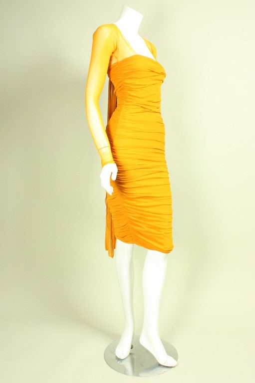 Sexy dress from Giorgio di Sant Angelo dates to the 1980's and is made of marigold stretch net.  Squared neckline.  Ruched body.  Center back tie creates interesting focal point.  Lined.  No closures.

Measurements-

Bust: 24-34