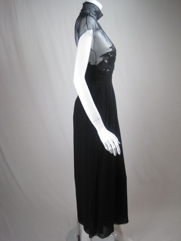 MARKED DOWN FROM $1050!

Bernard Perris Black Silk Ensemble consisting of bodysuit and wide-leg trousers.  Bodysuit has sheer and opaque areas that are bridged by organically placed bird appliqués that have sequins and beaded details.  Mock neck. 