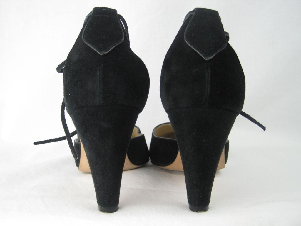 Manolo Blahnik t-strap pumps.  Extremely soft black suede.  Suede tie at ankle.  Tapered 3