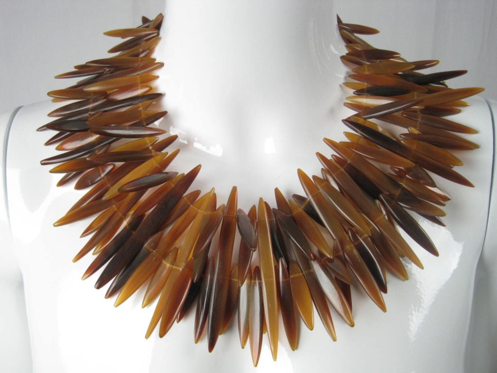 MARKED DOWN FROM $1400!

Gerda Lynggaard multi-strand horn necklace.  Amber-colored pointed horn has varied tones, lengths, and opacities.  Bronze-toned metal hook clasp.  Dated 1988.

Measurements-

Length: 20 3/4