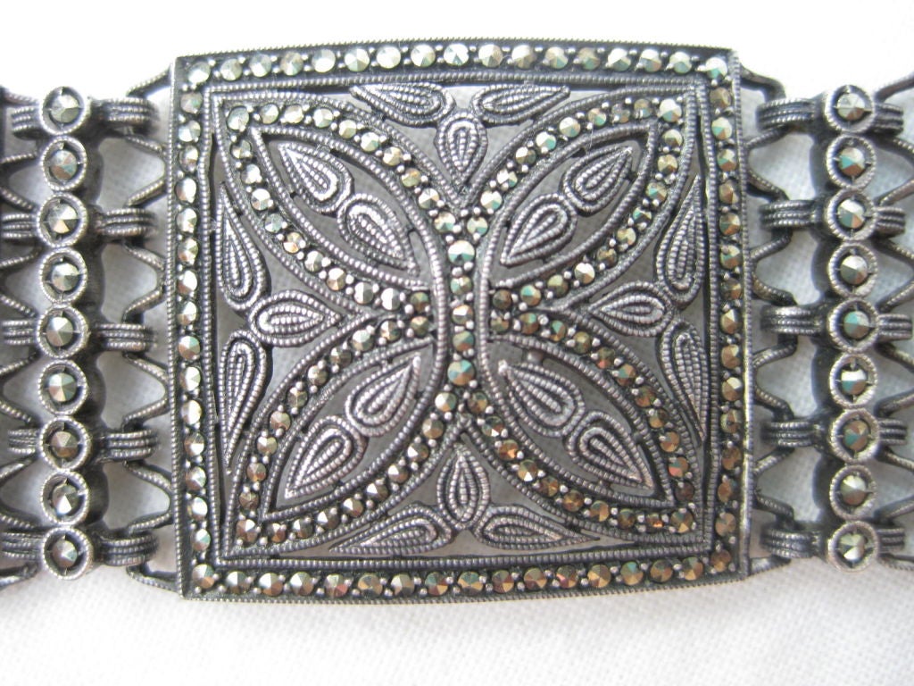 Sterling silver Art Deco link bracelet.  Filigree with marcasite. Stamped 