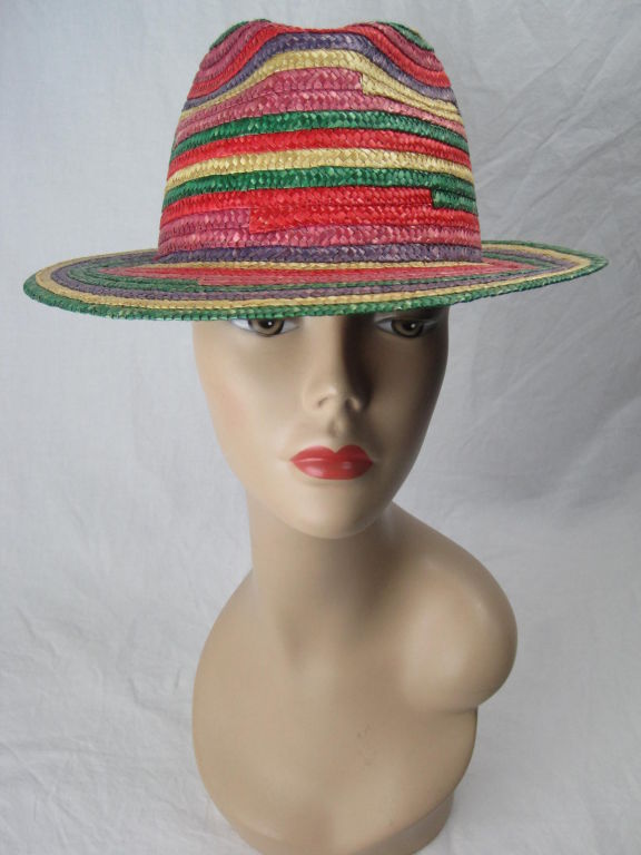 Saks Fifth Avenue summer fedora.  Brightly colored bands of straw.  Interior grosgrain hatband.  Unlined.

Interior Diameter: 21 1/8