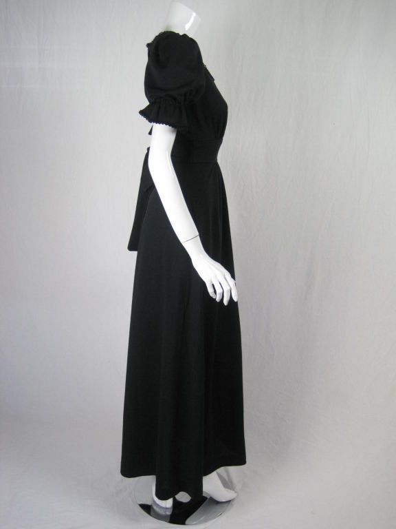 Radley maxi-length dress dating to the 1970's.  Scoop front neck with eyelet trim.  Short sleeves have elasticized cuffs.  Gathered waistband with attached tie.  Center back zipper.  Unlined.<br />
<br />
Labeled size 8.<br />
<br