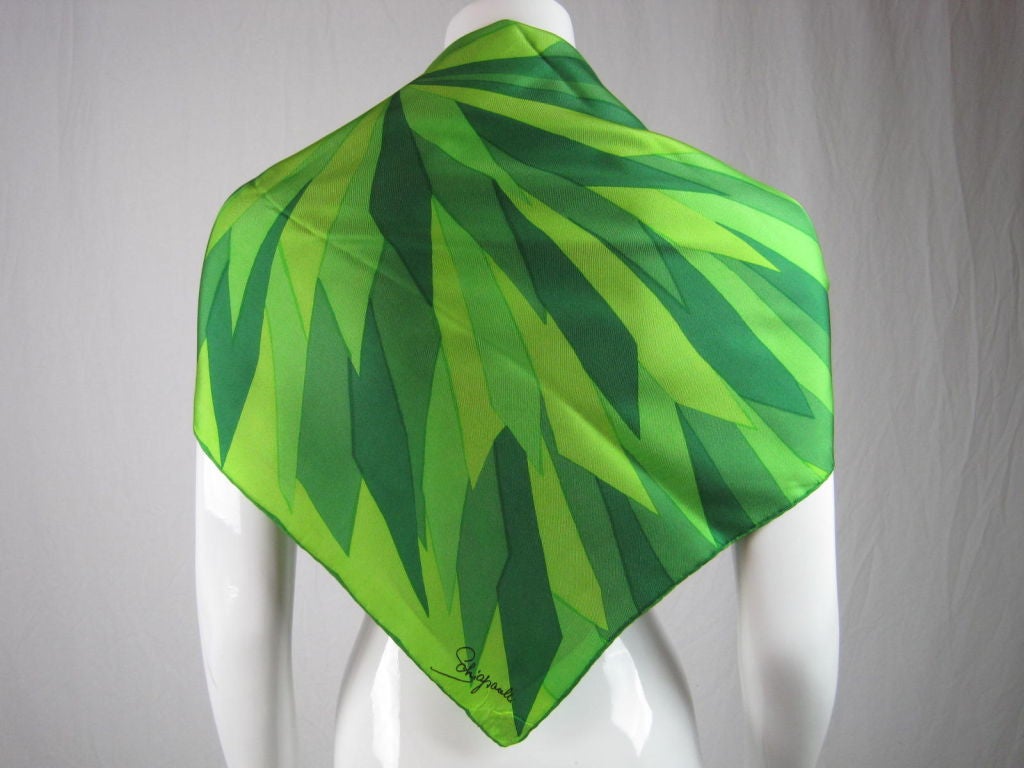 Stunning scarf from Elsa Schiaparelli.  Various shades of green on a lightweight silk.  Hand-finished, rolled edges.