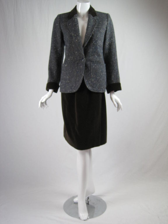 YSL 1970's suit mixes chocolate brown fine wale corduroy with blue, brown, and white nubby tweed.  Jacket has notch lapel, three patch pockets, turn-up cuffs, and corduroy accents.  Straight skirt is wrap-style, has side pockets, belt loops, and