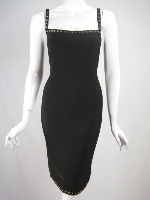 Incredibly sexy bandage dress from Herve Leger.  Dark chocolate brown signature knit is adorned with gold-toned studs along neckline, straps, and hem.  Squared scoop neck.  Side zip.  Unlined.

Labeled size 3 FR and Large