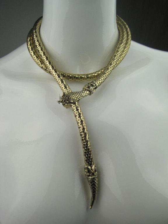 Gold-toned mesh snake belt or necklace from Whiting & Davis.  Relief detailing at head and tail.  Hinged clamp head.  Marked 