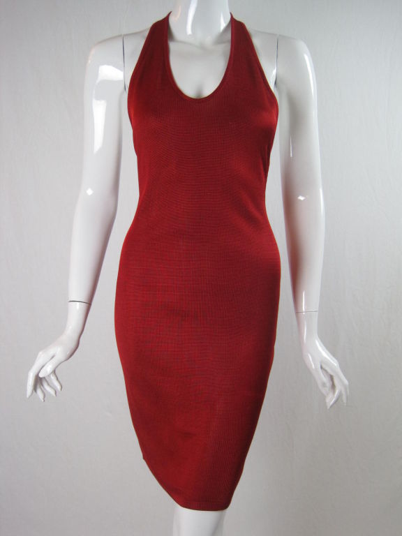 Incredibly sexy halter dress from Alaia.  Tomato red fine knit with bronze snaps at back neck and center back.  Low cut back.  Scoop neck.  Unlined.  <br />
<br />
Labeled size Medium.<br />
<br />
Measurements-<br />
<br />
Bust: 28-36