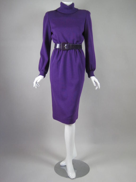 Bill Blass dress circa 1980's.  Bright purple wool knit.  Ribbed yoke, turtleneck, and cuffs.  Fully lined.  Center back zip with hook and eye closures at neck.  Comes with purple snakeskin belt from I. Magnin that does not appear to be original to