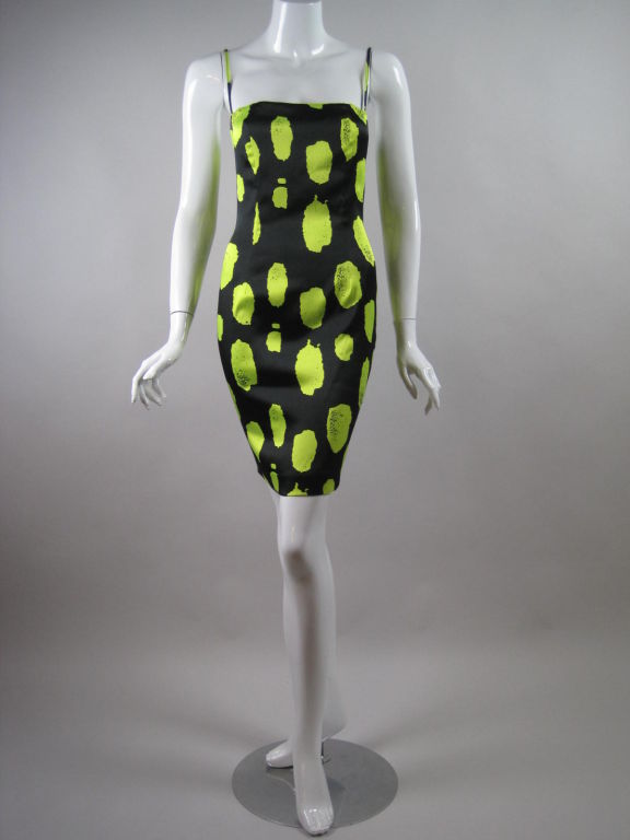 Stephen Sprouse fitted mini dress circa 1988.  Shiny black fabric with Day-Glo yellow print.  Spaghetti straps.  Center back invisible zipper.  Lined.

Labeled size 4.

Measurements-

Bust: 32-33